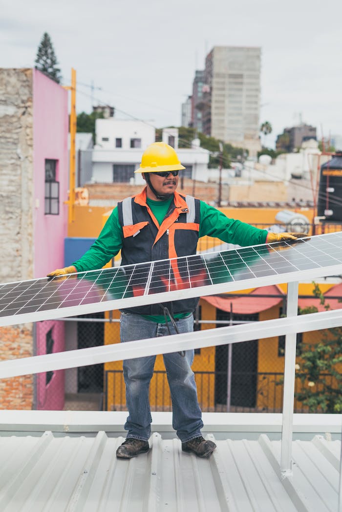 About A solar technician adjusts photovoltaic panels on a colorful urban rooftop.